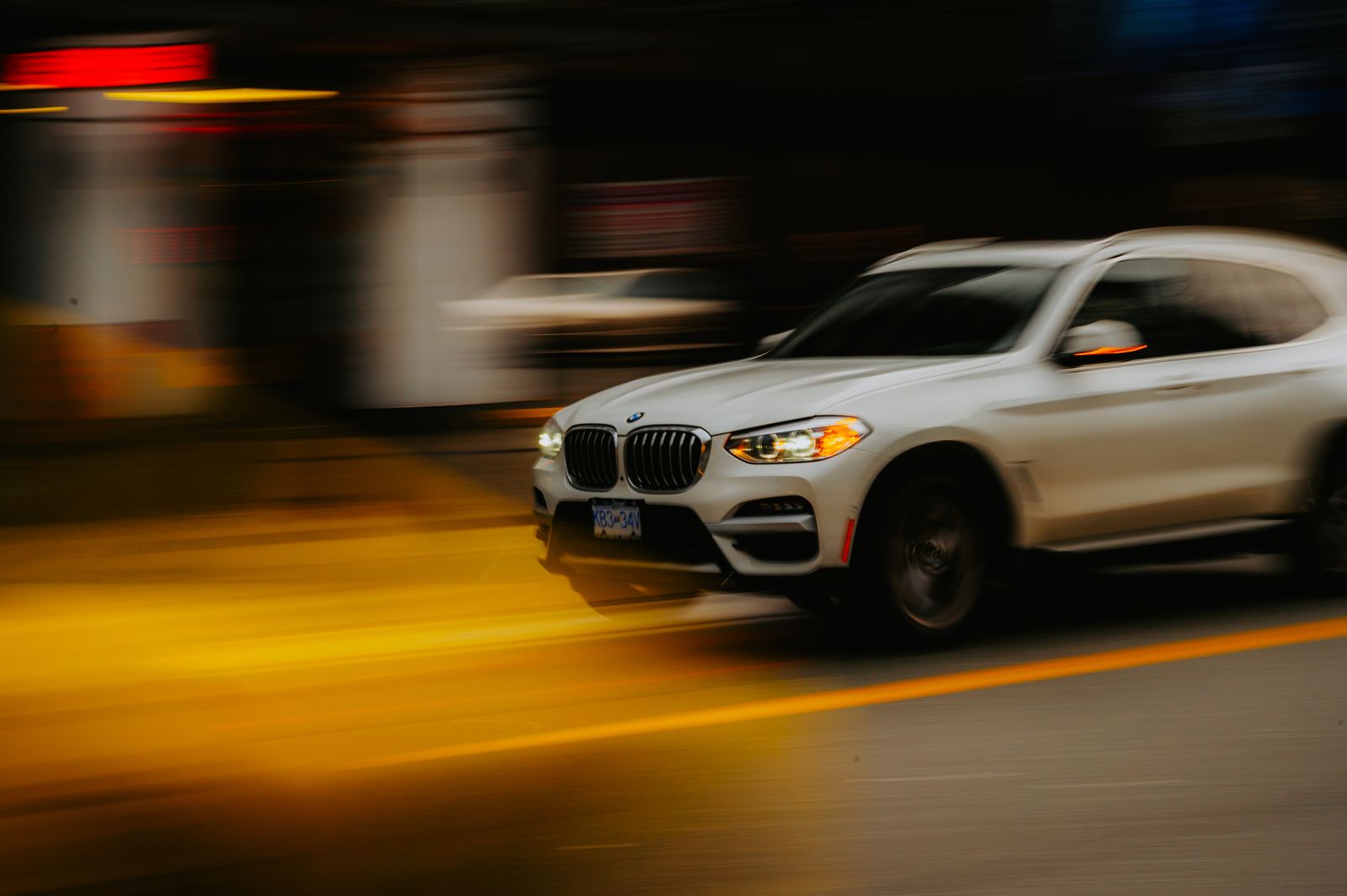 SUV driving through a city street in Uptown Dallas